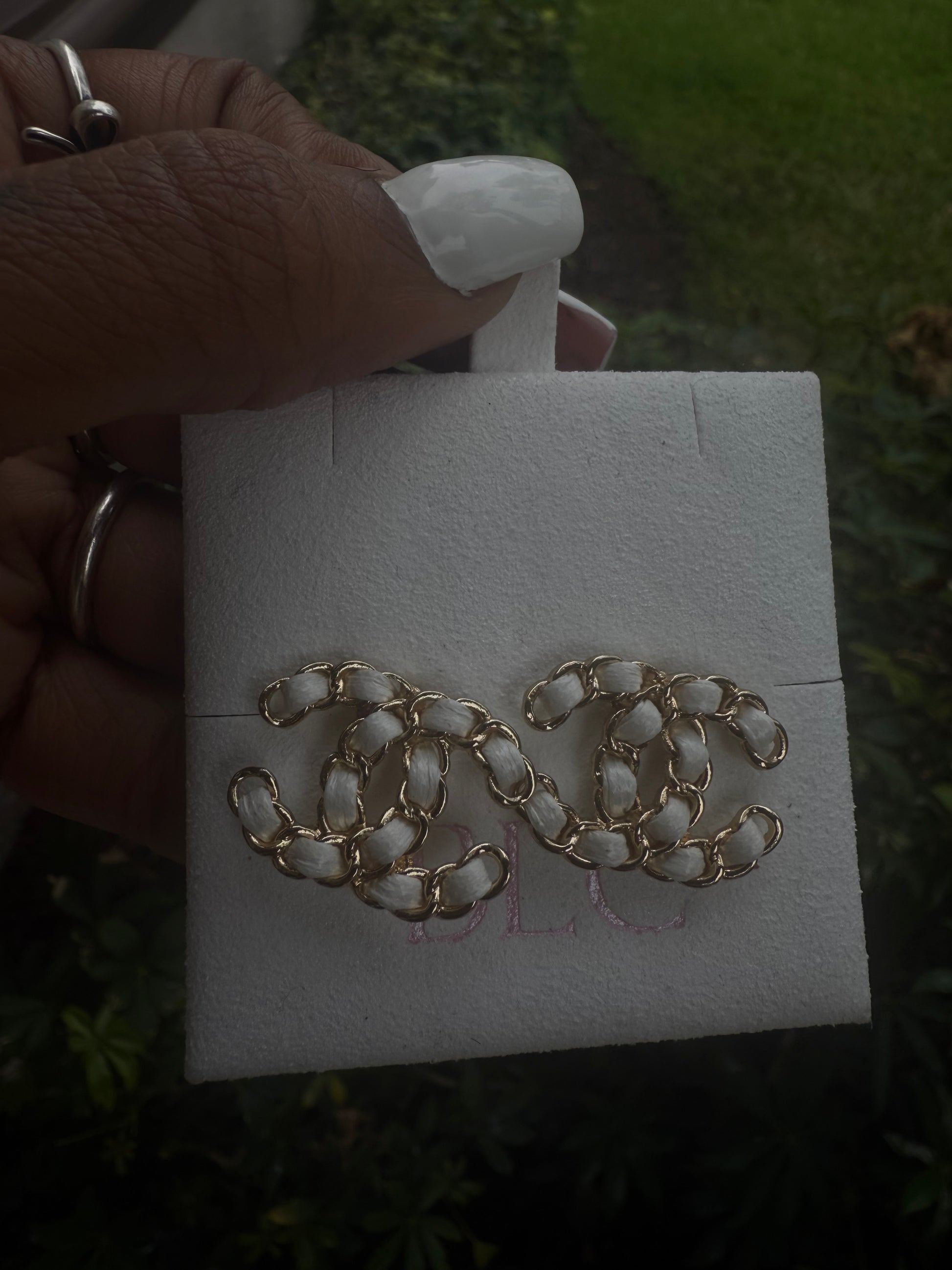 White cc earrings