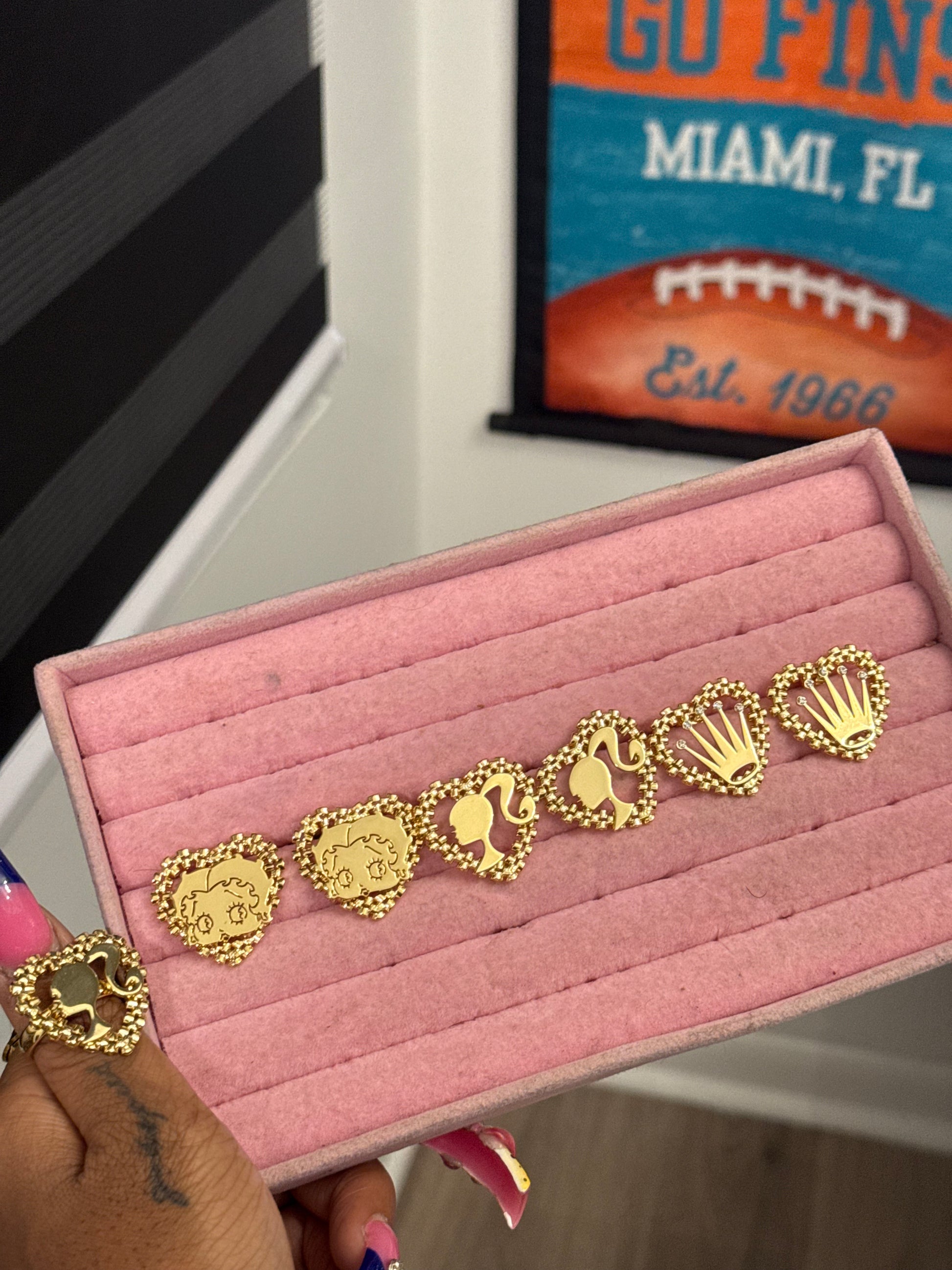 Character Rolex earrings